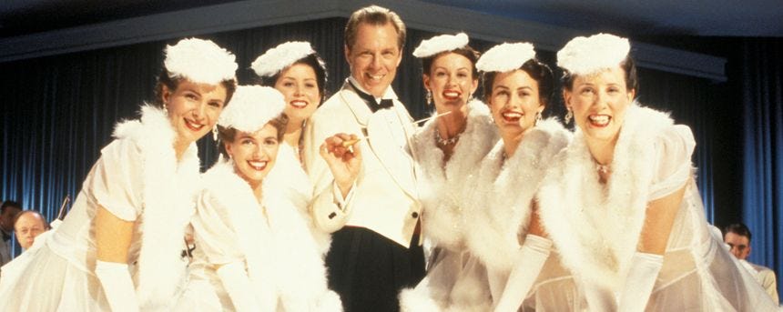 Bandleader Rick Rochester (Michael McKean) and dancers in Radioland Murders.