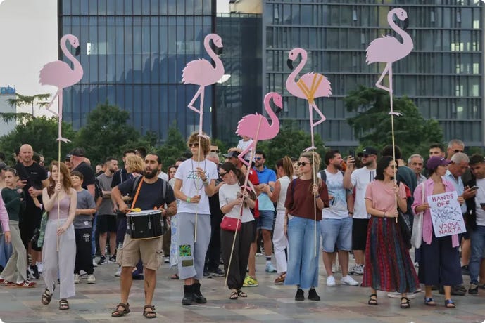 Clockwise from top left: Activists outside a Starbucks store in Seoul (Pedro Pardo/AFP/Getty Images); demonstrator at a protest against a U.S.-backed quarantine plan for a facility at a Kenyan air force base for Americans exposed to Ebola (John Muchucha/Reuters); protesters in Tirana with pink flamingo cutouts oppose a Trump-linked luxury project (Hameraldi Agolli/AP); police stand guard where teachers from Mexico's National Coordination of Education Workers union have set up an encampment in Mexico City (Luis Cortes/Reuters).