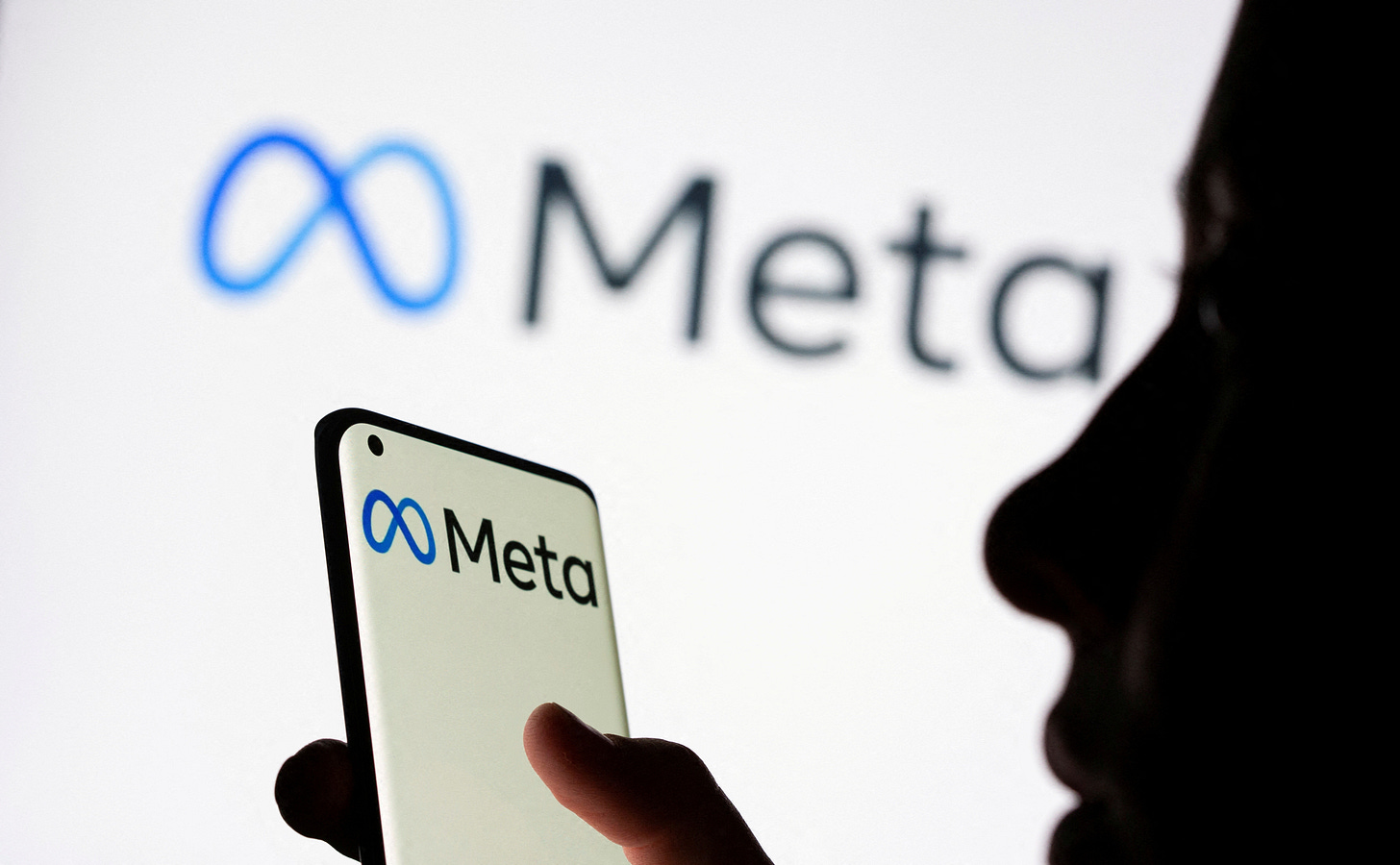 Meta heats up Big Tech's AI arms race with new language model | Reuters