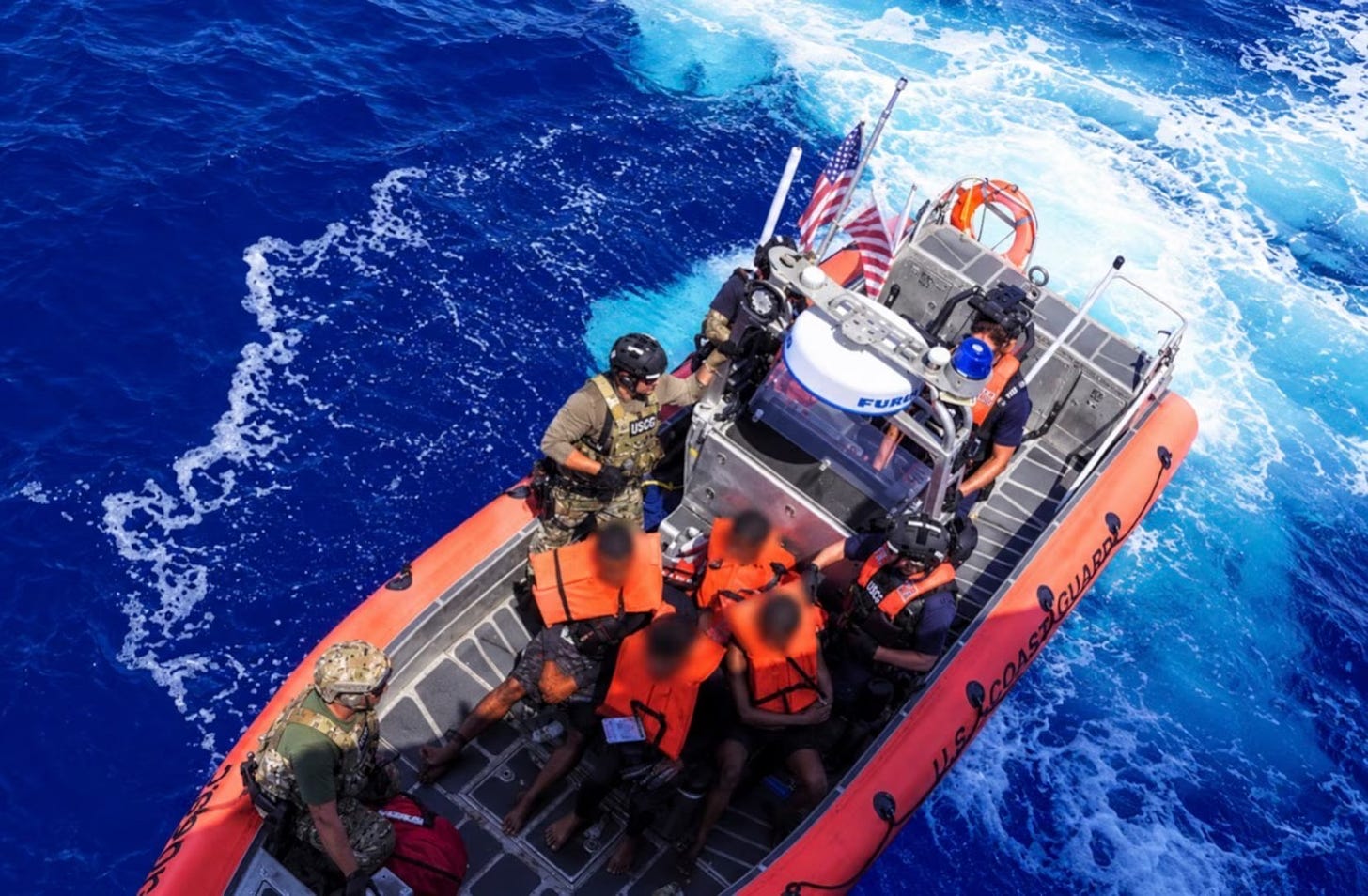 A small boat crew carries Cuban migrants taken from a small smuggling boat intercepted in the Atlantic Ocean to the Coast Guard Cutter Wiliam Flores’ prior to being returned to their country on September 10, 2026 (US Coast Guard photo) A small boat crew carries Cuban migrants taken from a small smuggling boat intercepted in the Atlantic Ocean to the Coast Guard Cutter Wiliam Flores’ prior to being returned to their country on September 10, 2026 (US Coast Guard photo)