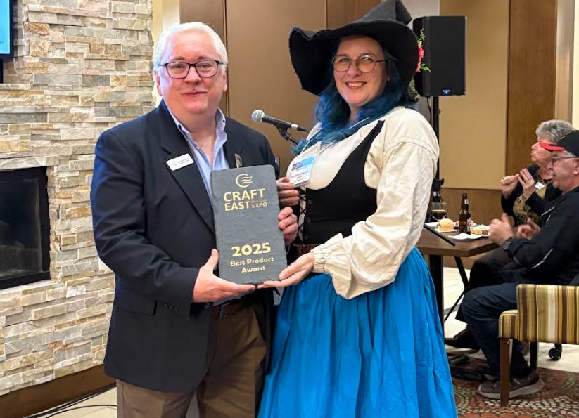 Photo of Pam Boutilier receiving an award at the 2025 Craft East Buyer's Expo