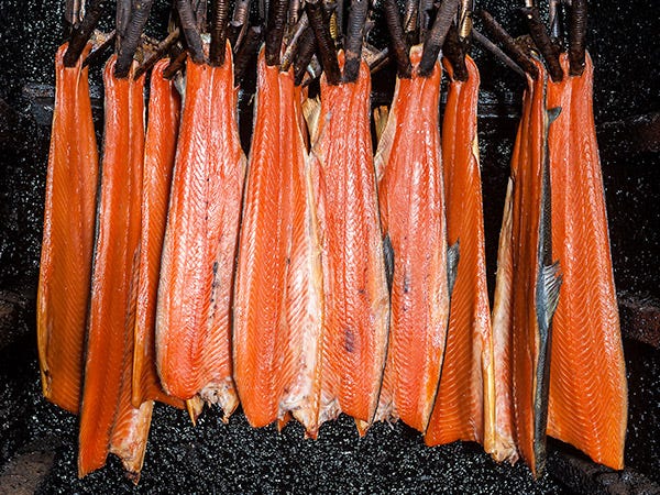 smokehouse with salmon hanging in kiln