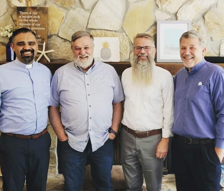 May be an image of 4 people, beard and people standing