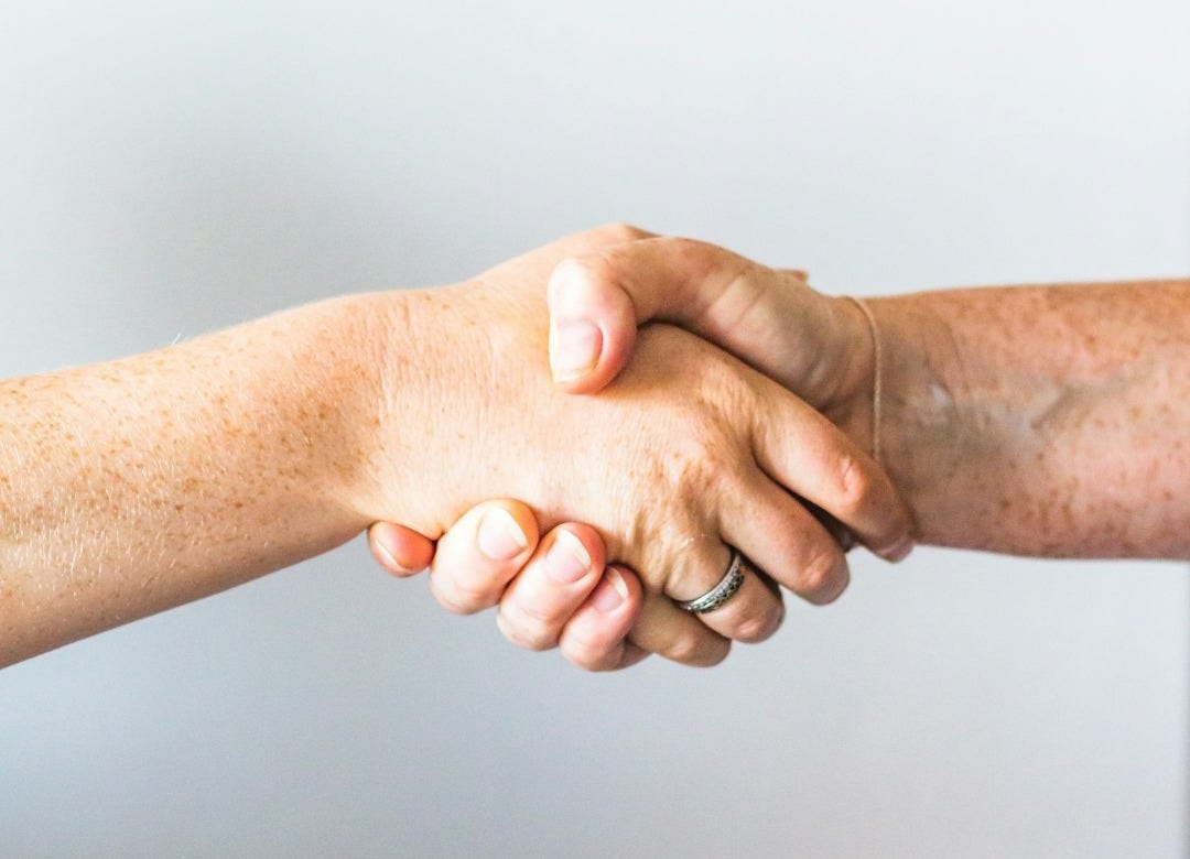 person holding hands of another person