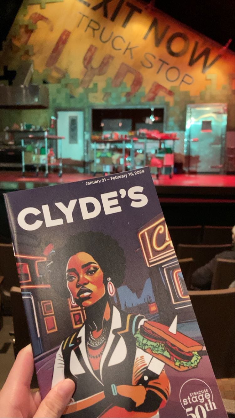 A picture taken at the Syracuse Stage showing of "Clyde's". I hold up a programme in front of the "Clyde's" stage.