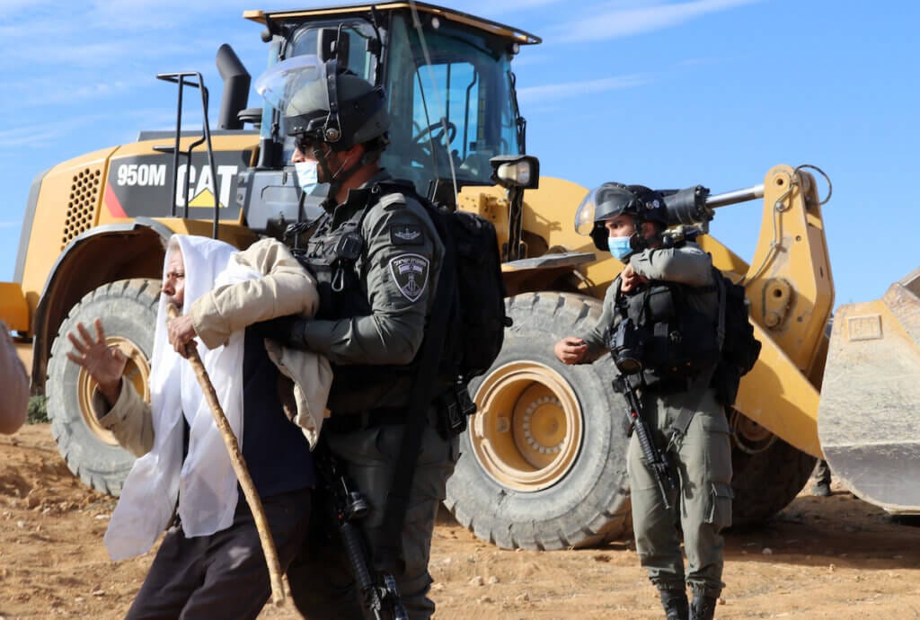 Palestinians protest as Israeli forces demolish a Palestinian house in in Masafer Yatta near Hebron in the Israeli-occupied West Bank November 25, 2020. (Photo: Mosab Shawer/APA Images)