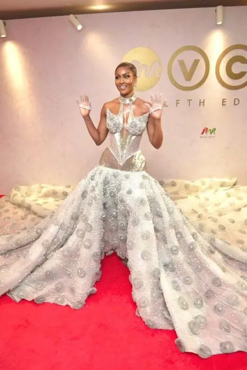 BBC/GIFT UFUOMA Osas Ighodaro is wearing a silver corset flowing dress embellished with hudreds of stones and crystals.