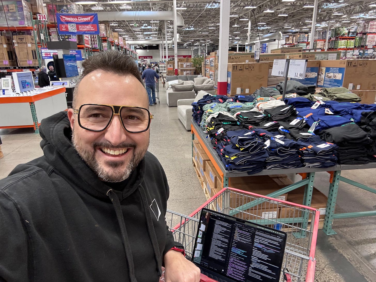 entering Costco with my laptop in the top basket of my shopping cart