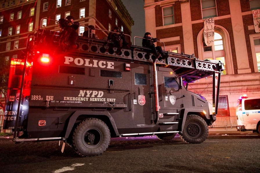 A police vehicle with a ladder on top

Description automatically generated