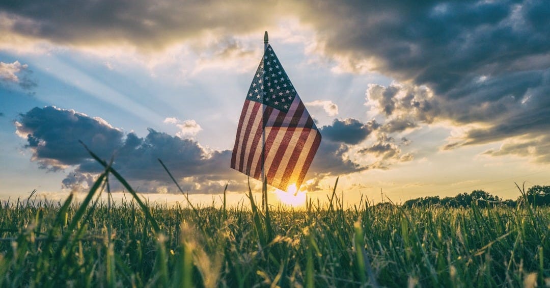 flag of USA on grass field