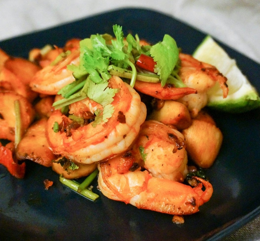 cooked shrimps on blue ceramic plate cooked shrimps on blue ceramic plate