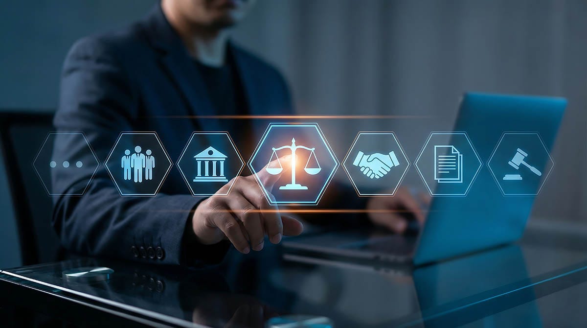 Dude typing with various legal icons overlaying the graphic
