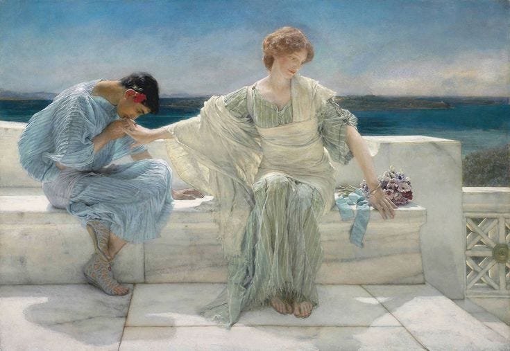 This may contain: two women sitting on a ledge next to each other
