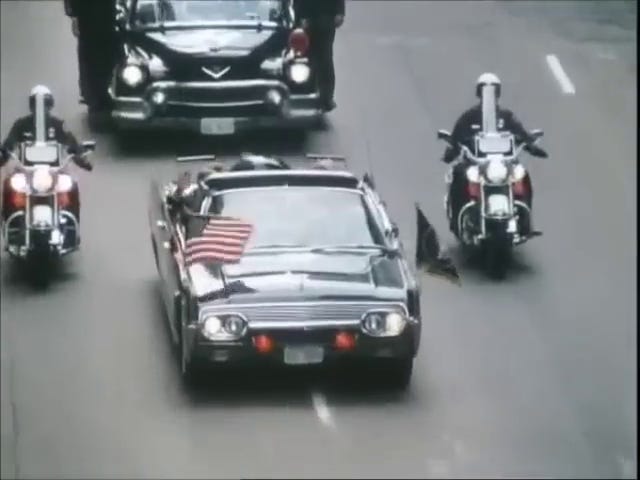 JFK in the motorcade, Jackie in the motorcade, cars in the motorcade, JFK shakes nuns' hands.