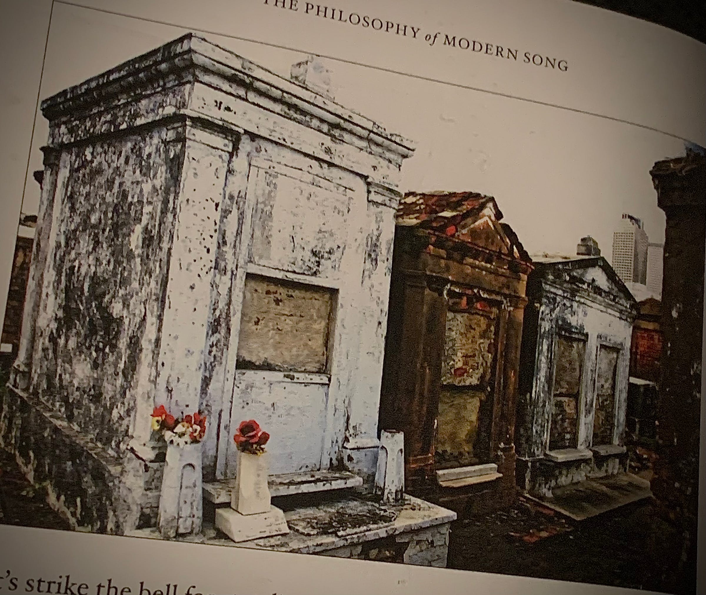 Image of three mausoleums in a cemetery