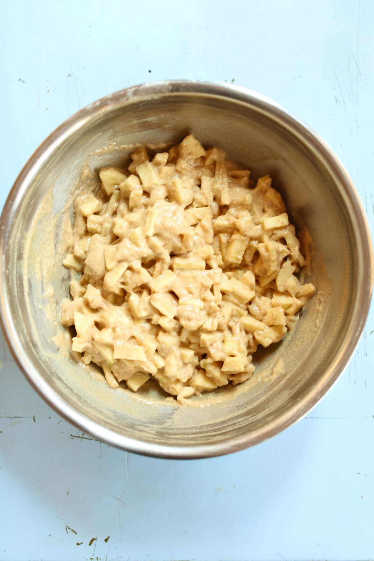 a bowl of apple fritter batter.