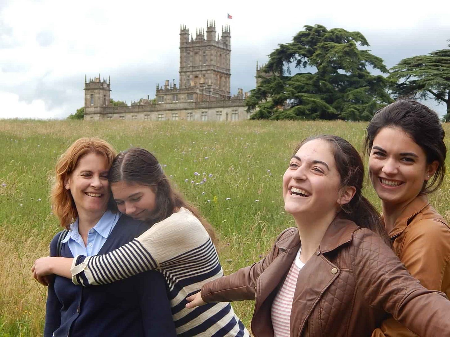 A mom and her three teenaged daughters enjoy the landscape surrounding Highclere Castle, the home of Downton Abbey A mom and her three teenaged daughters enjoy the landscape surrounding Highclere Castle, the home of Downton Abbey