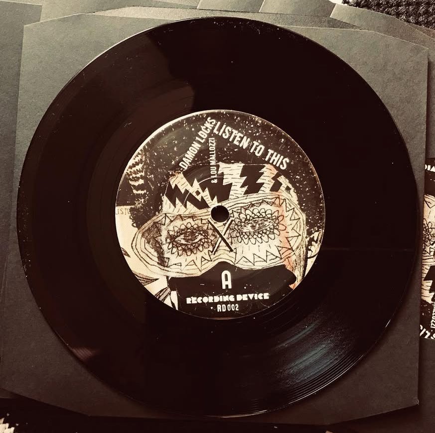 7" to support the exhibition Damon Locks: We Are Our People / Listen To This, Goldfinch, Chicago, IL, March 22 – May 3, 2025; Side A: Listen to This, Featuring Lou Mallozzi, [Side B: The Riots Came Through Here, high notes by Tramaine S. Parker and Eva Supreme], RD002, Recording Device, 2025, Edition of 100