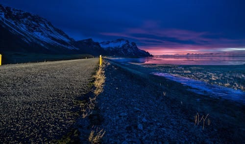 Free Gray Rocky Road during Nightime Stock Photo