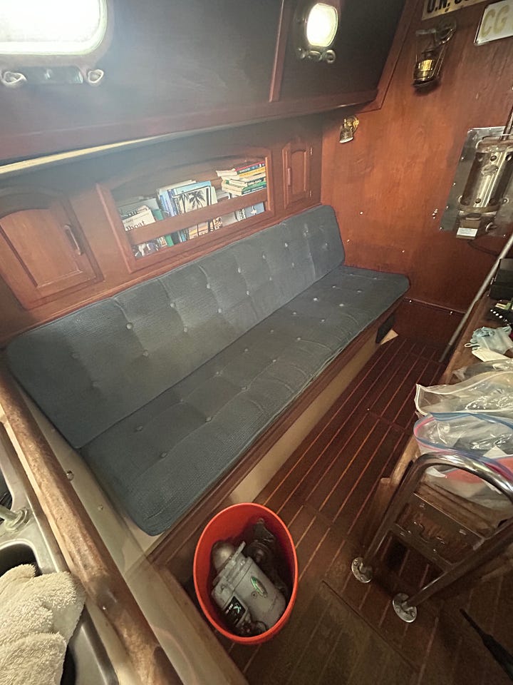 Pacific Seacraft sailboat on lift and stands. Pacific Seacraft interior organization.