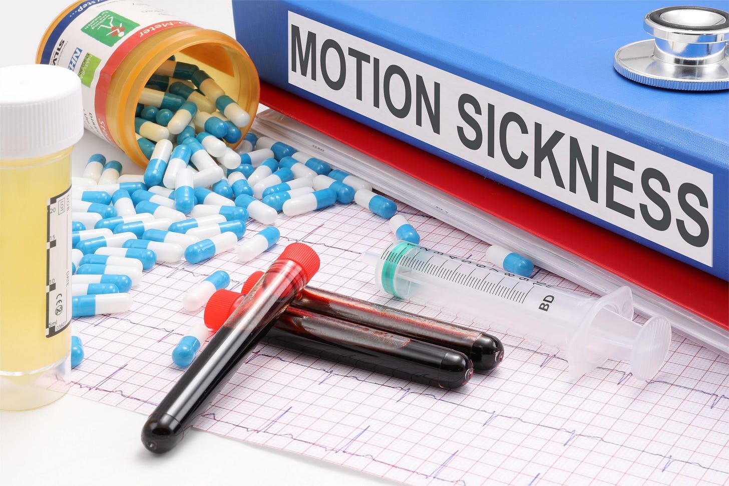 book reading "motion sickness" surrounded by vials of blood, pill, and an EEG trace