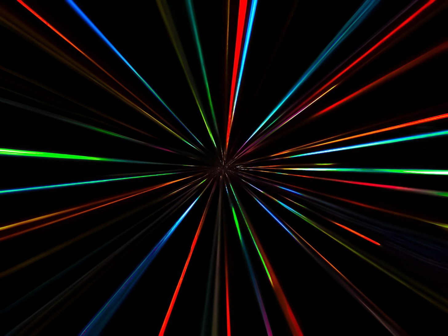 colorful laser beams converging on black background colorful laser beams converging on black background
