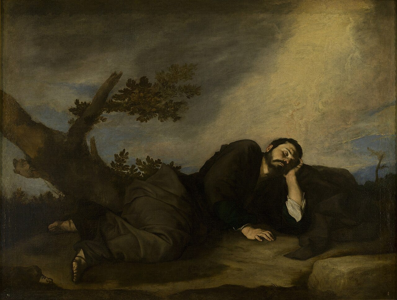 Man asleep against rock