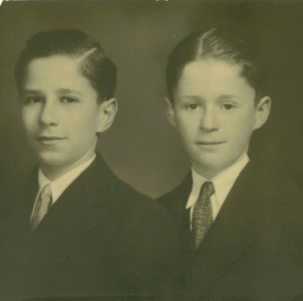 A couple of young boys in suits
AI-generated content may be incorrect. A couple of young boys in suits
AI-generated content may be incorrect.
