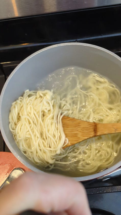 Nissin Raoh instant ramen packet being opened, noodles cooked, sauce packets mixed, and final product served in a delicious soupy bowl.