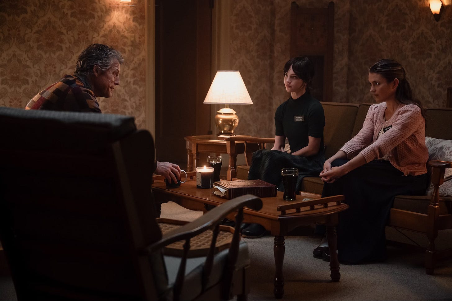 Hugh Grant, Sophie Thatcher, and Chloe East in Heretic 
