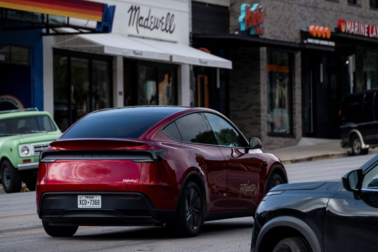 How Tesla's robotaxi efforts stack up against Waymo and Zoox | Reuters