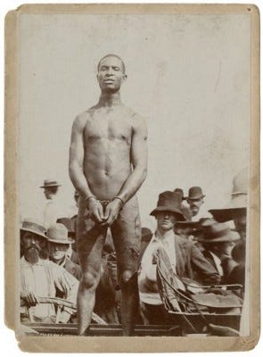 Photo of slave auction attended by southern "gentlemen." Photo of slave auction attended by southern "gentlemen."