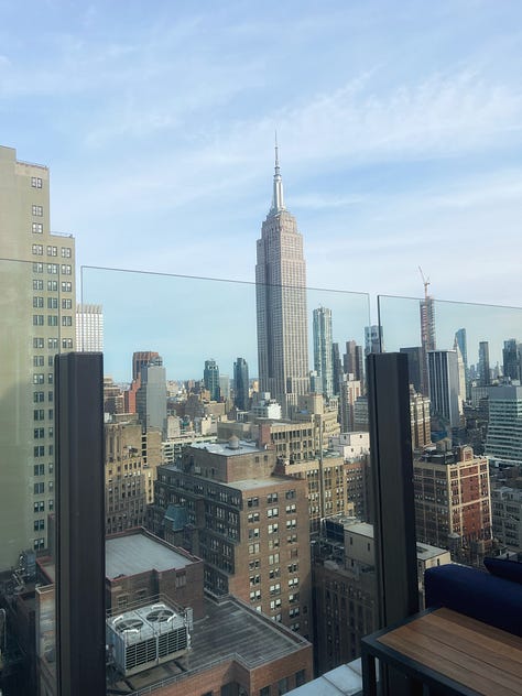 Photos of the Empire State Building and a dirty martinin at the Skylark Rooftop Bar in NYC.
