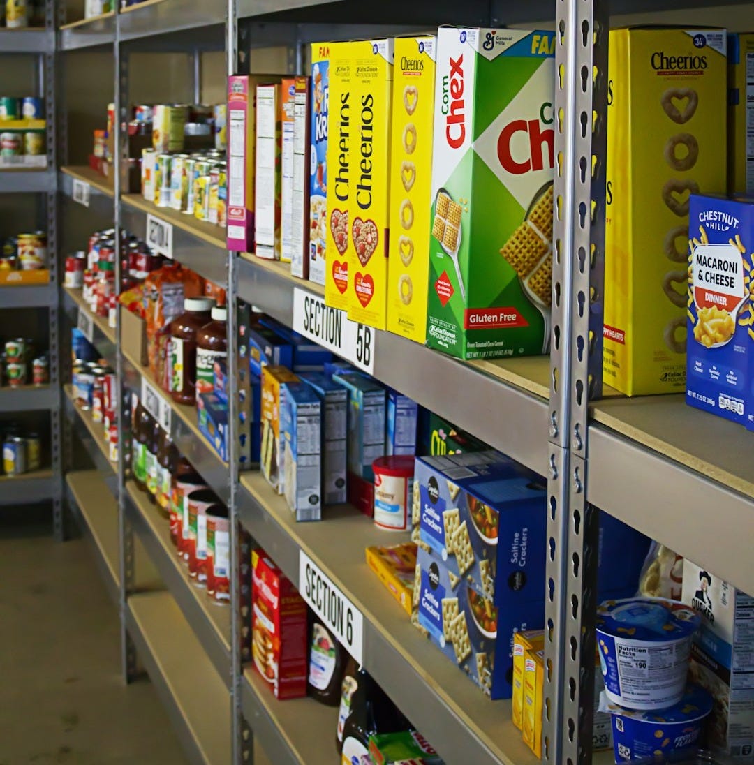 A shelf in a store filled with lots of food