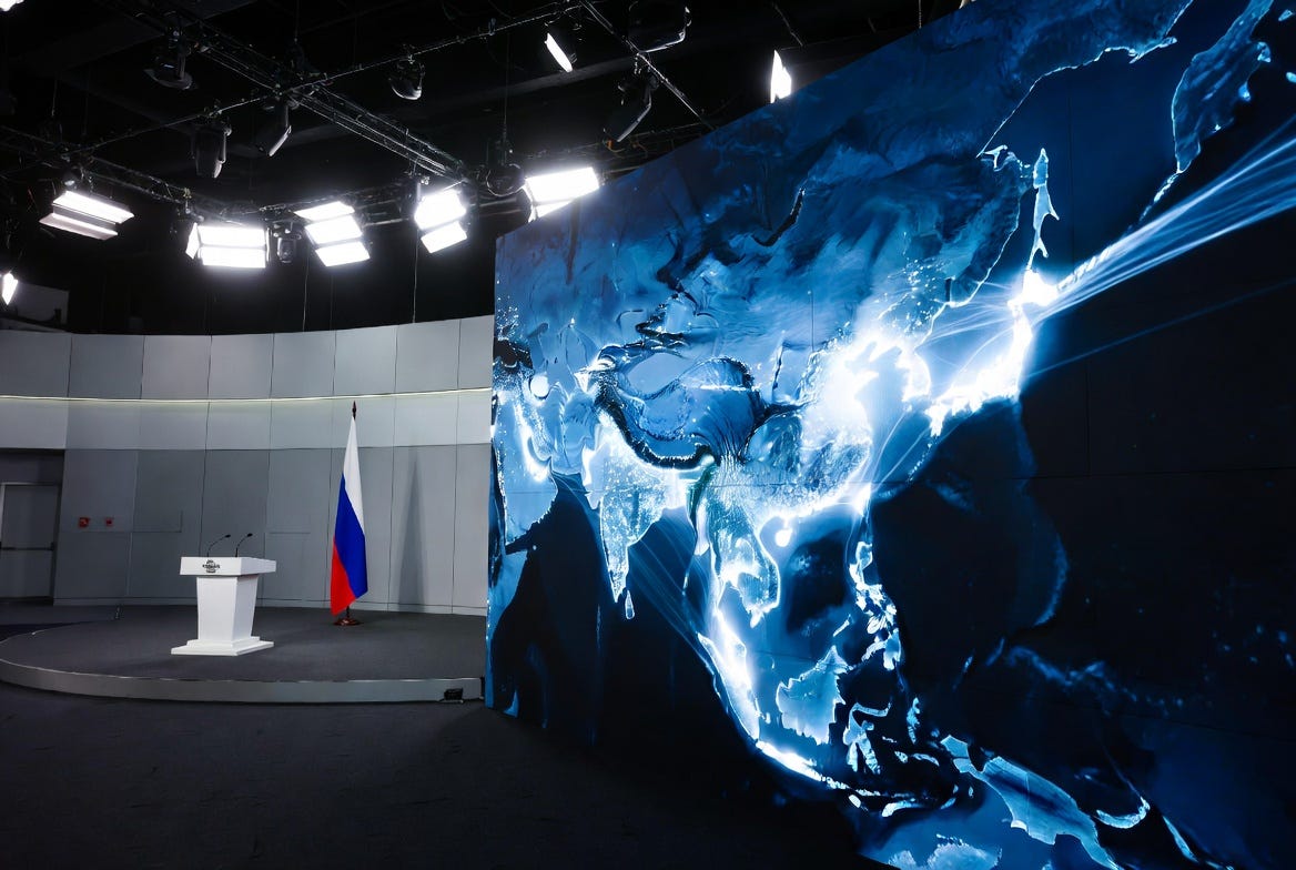 Formal government ceremony interior with a podium, Russian flag, and a large screen showing glowing Asia-Pacific trade route lines, representing the state-sanctioned launch of A7's Far Eastern financial hub with Vladimir Putin's attendance. Formal government ceremony interior with a podium, Russian flag, and a large screen showing glowing Asia-Pacific trade route lines, representing the state-sanctioned launch of A7's Far Eastern financial hub with Vladimir Putin's attendance.