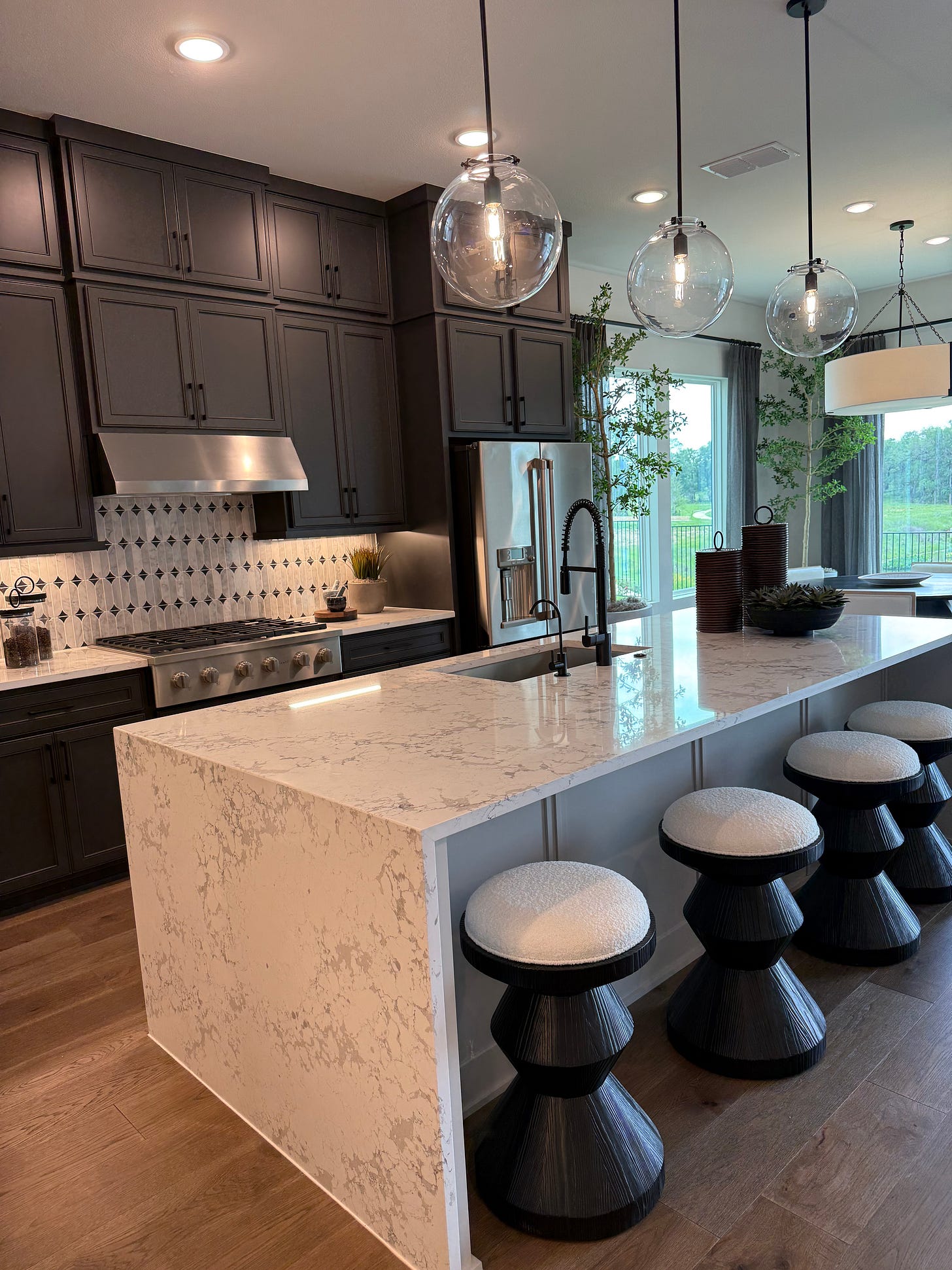 Warm, neutral 2026 staging palette with layered lighting in a Central Texas home.