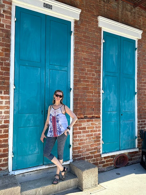 Images of New Orleans' French Quarter + swamp, including iconic balconies dripping in ferns, a swamp gator near Slidell, Jordan in front of blue doors, a cemetary and two tarot card spreads.