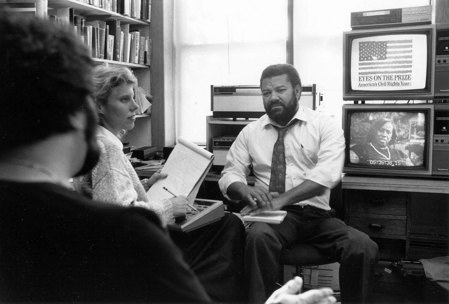 Two men and woman in office Two men and woman in office