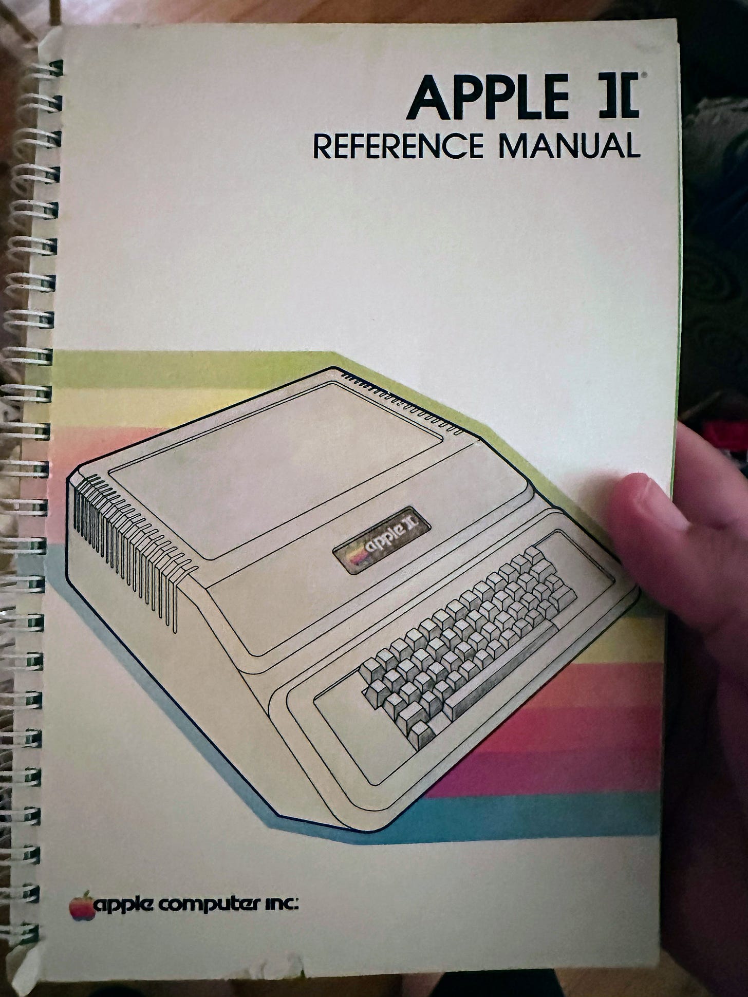 Author holding a copy of the Apple ][ Reference Manual.