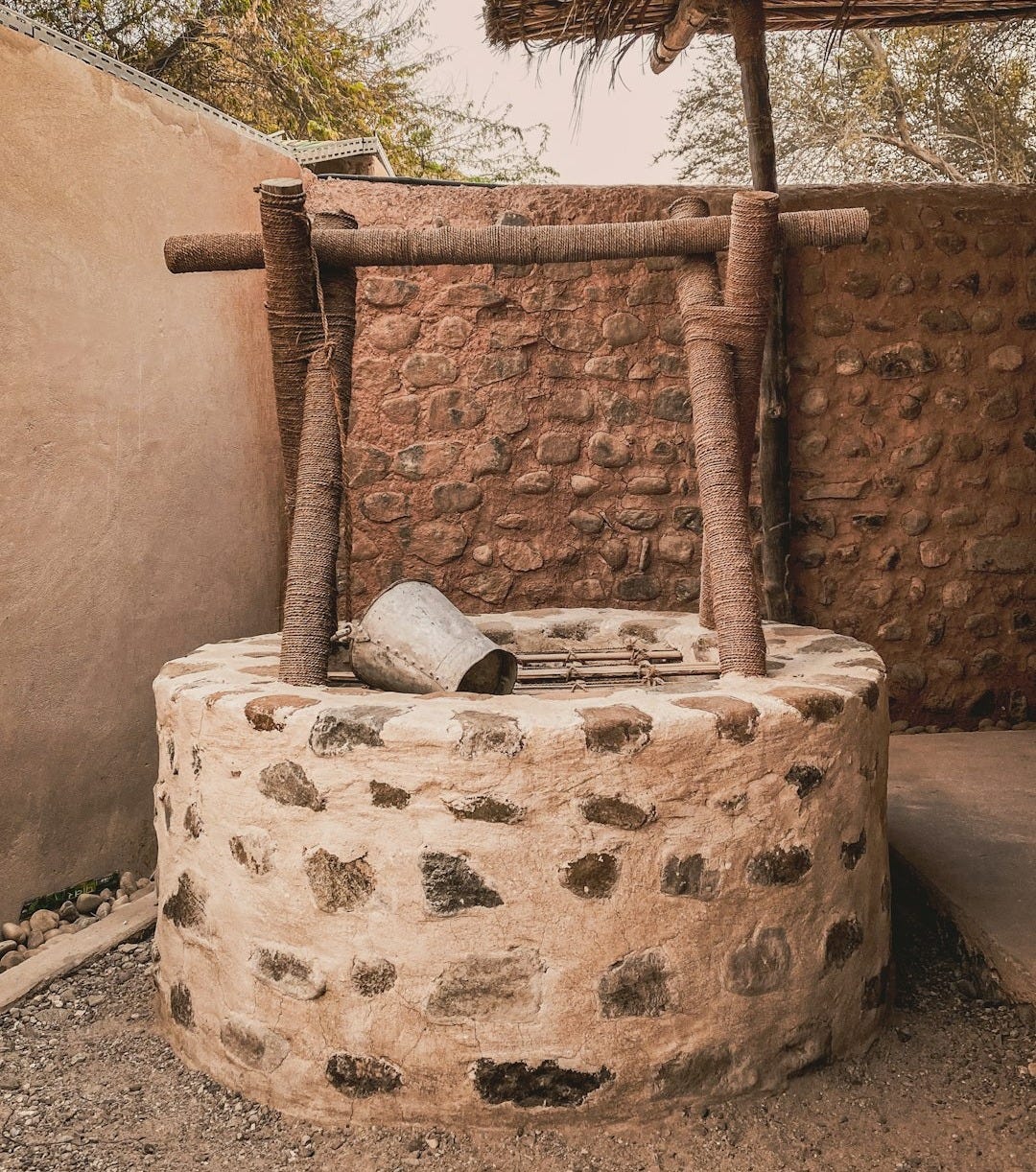 a stone structure with a roof a stone structure with a roof