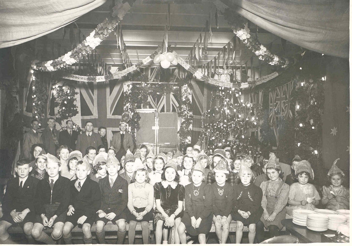 Children sit together for a photograph to mark the Christmas party.