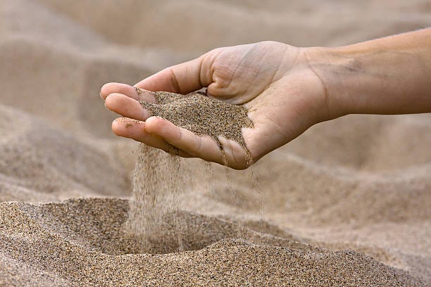 1,200+ Sand Flowing Through Fingers Stock Photos, Pictures ...