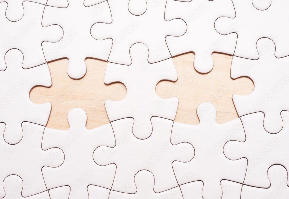 White blank puzzle with 2 pieces missing on wooden board with copy space. Stock Photo | Adobe Stock White blank puzzle with 2 pieces missing on wooden board with copy space. Stock Photo | Adobe Stock