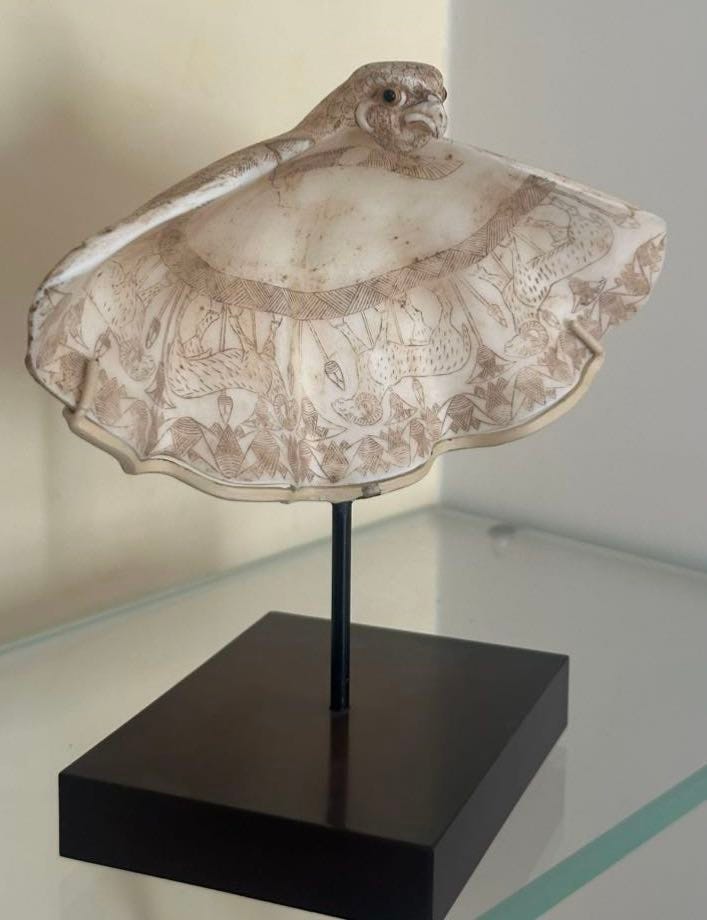 A statue of a person in a dress

Description automatically generated