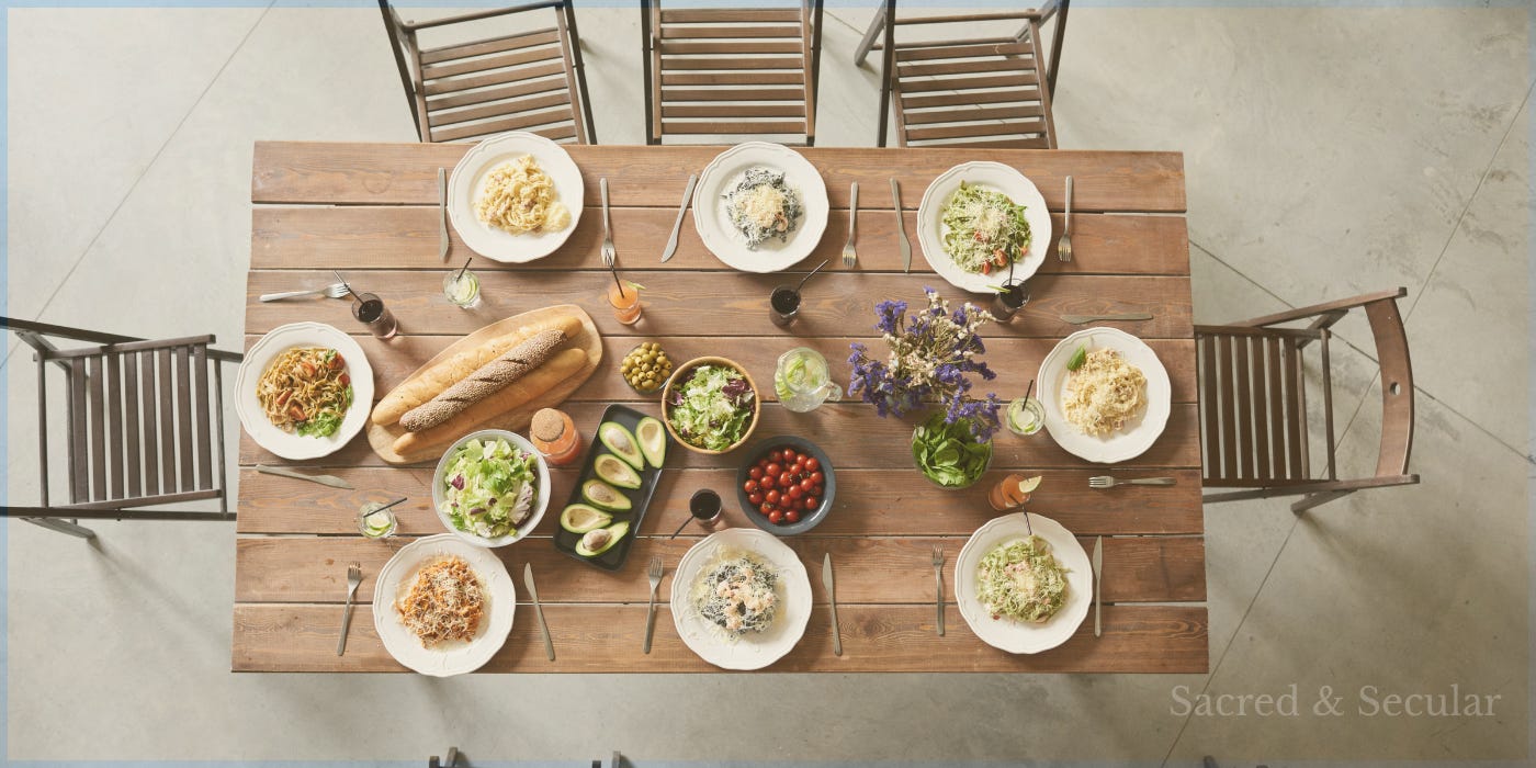 A simple wooden table laid ready for a meal with empty chairs A simple wooden table laid ready for a meal with empty chairs