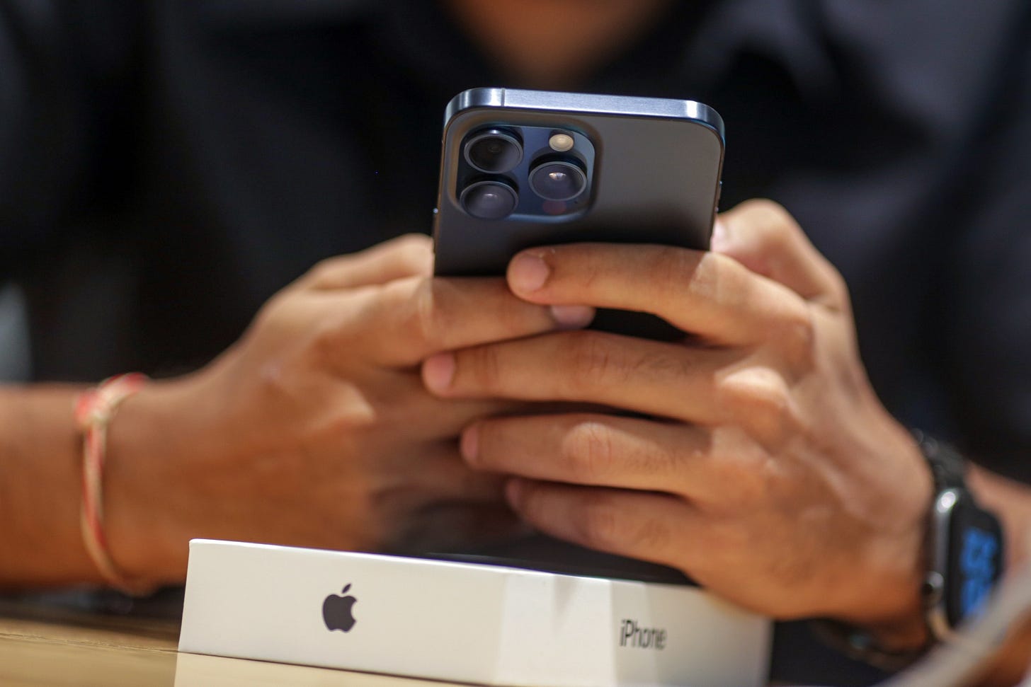A customer uses an iPhone 15 Pro.