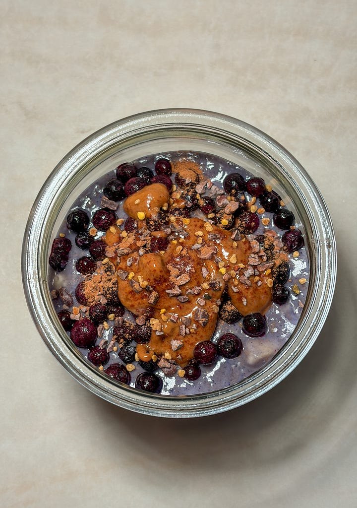Iced salted honey collagen matcha latte and a coconut-cashew yogurt bowl with frozen blueberries, almond butter, and bee pollen