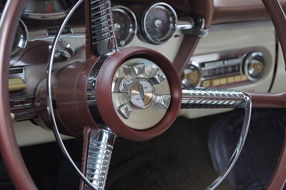 A close-up of a steering wheel

AI-generated content may be incorrect.