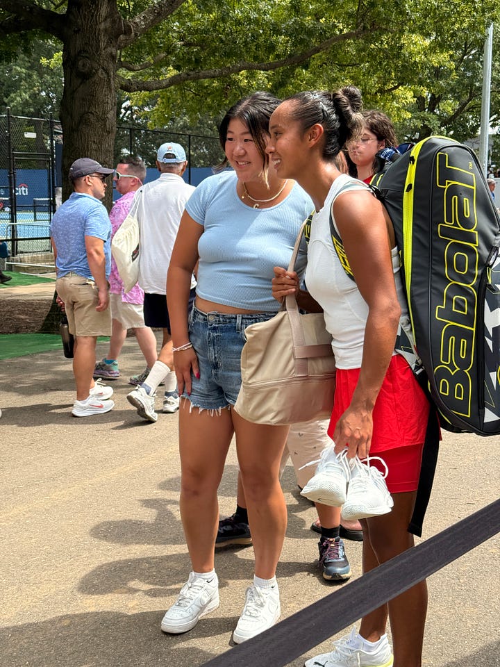 Daniil Medvedev and Leylah Fernandez signing autographs and taking selfies