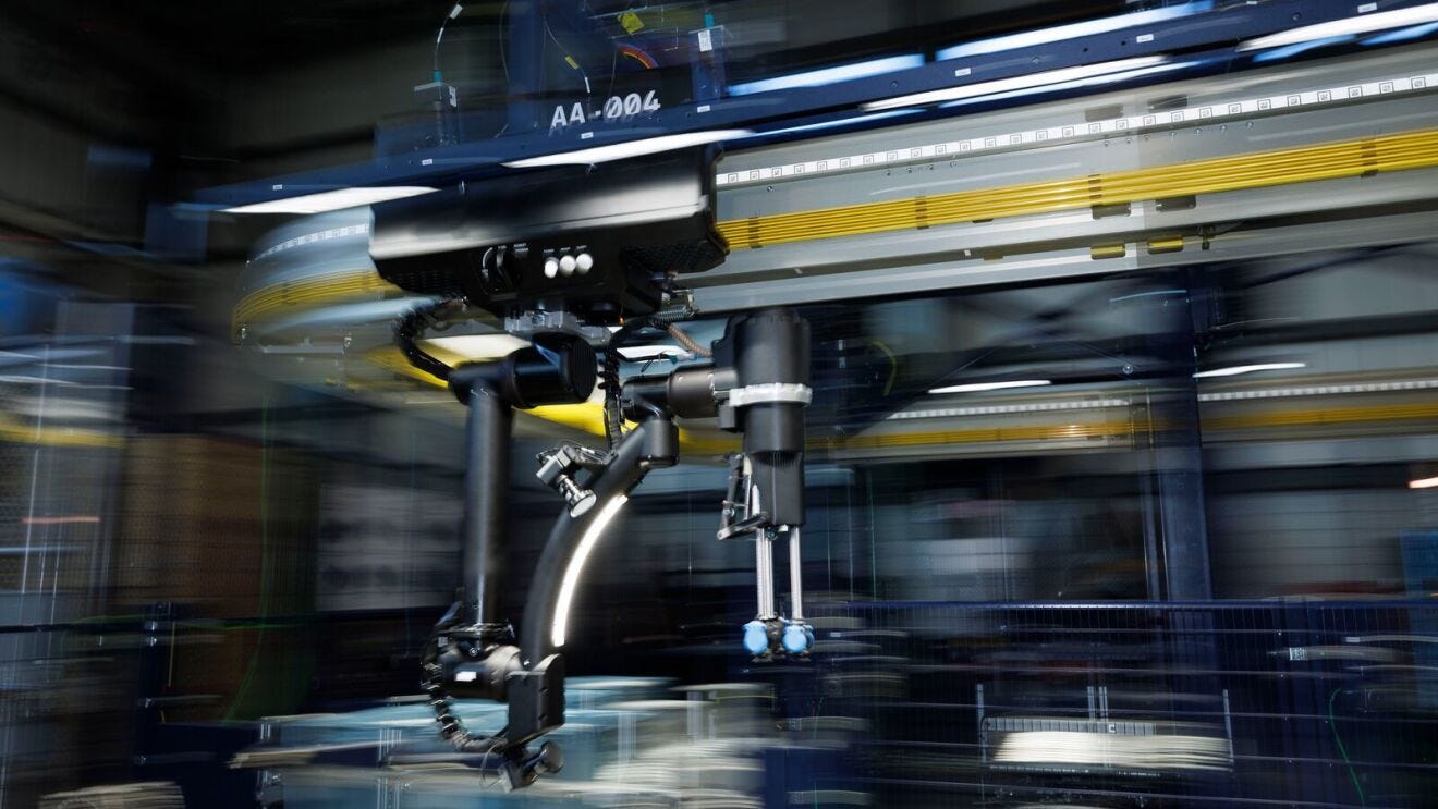 High-speed manufacturing robot with multiple joints, dynamic factory environment